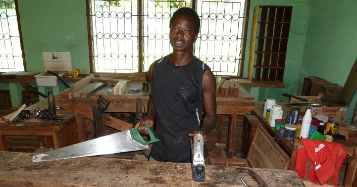 Woodworking classroom at Mua showing the previous carpentry teacher (photo taken in 2012)